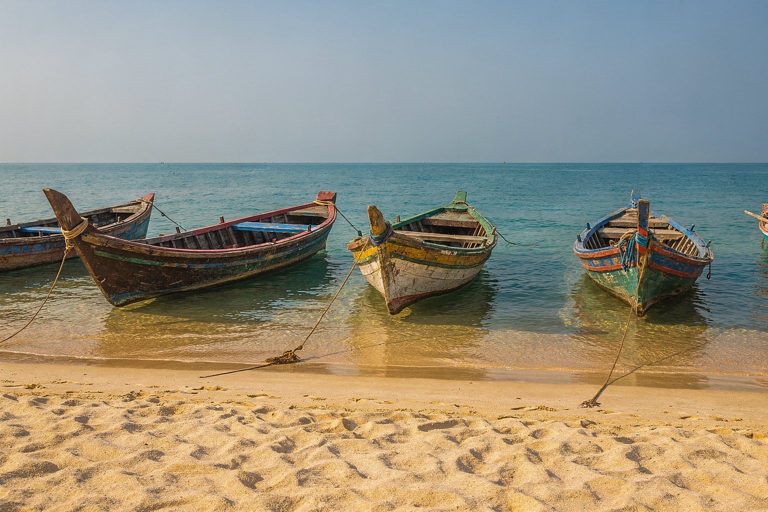 Quiet beach with fishing boats on the southern Tamil Nadu coast (illustrative image)